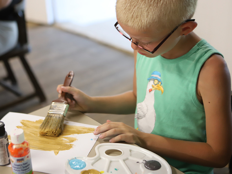 Camp Tanager 11 Child painting at Camp Tanager